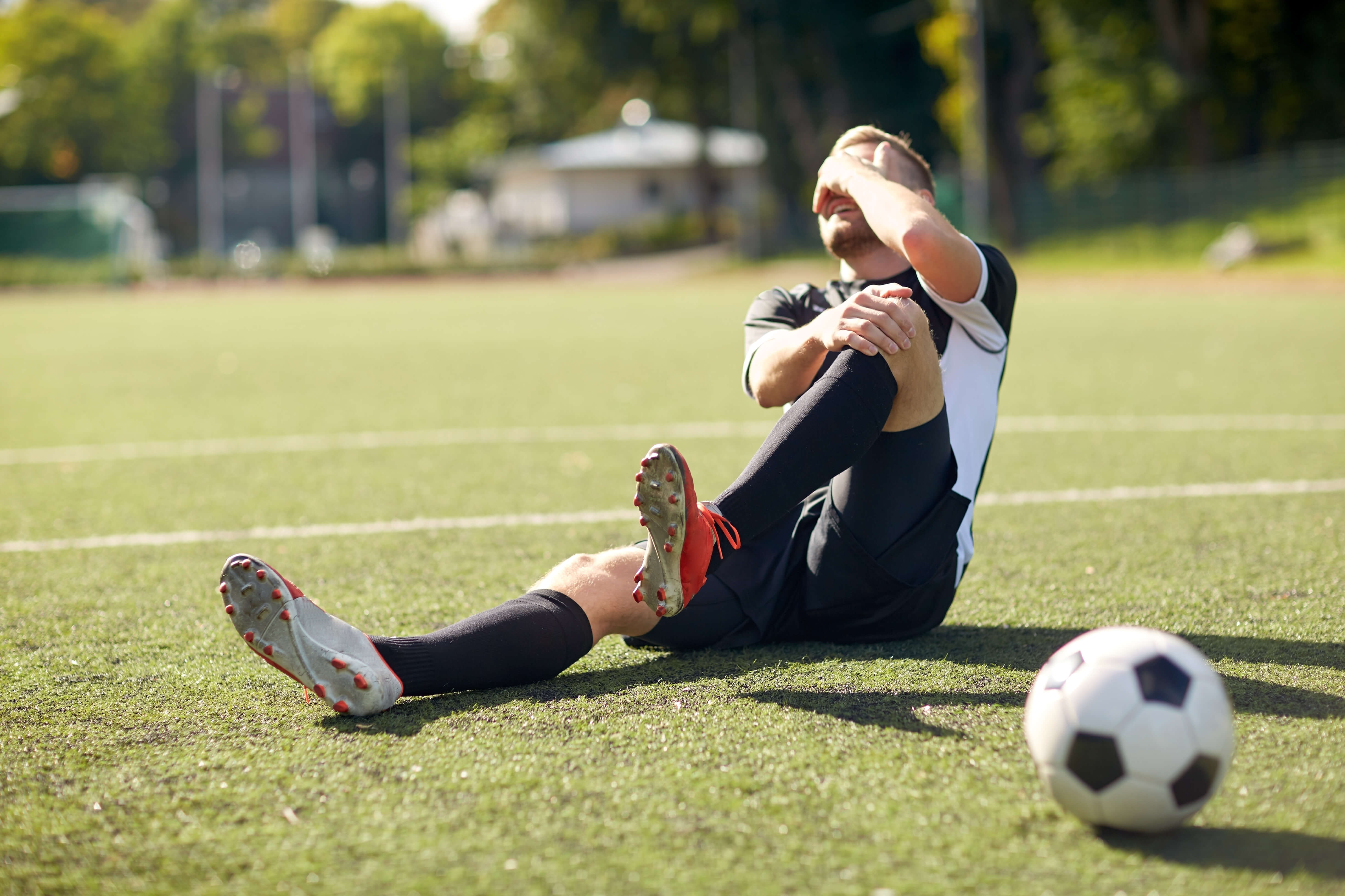 Your sport. Футбольное поле с людьми. Футболисты на поле фотосток. Sports injuries. Фотографии людей с мячами.