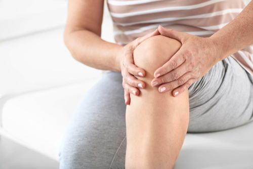 What could be causing a stiff knee that’s painful when bent? shutterstock 1593904273 stiff knee pain when bending