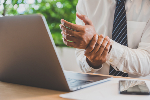 Why do I have wrist pain from typing? shutterstock 1296208102 wrist pain from typing