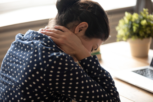 Why am I feeling neck pain at the base of my skull? shutterstock 1606121236 neck pain at base of skull