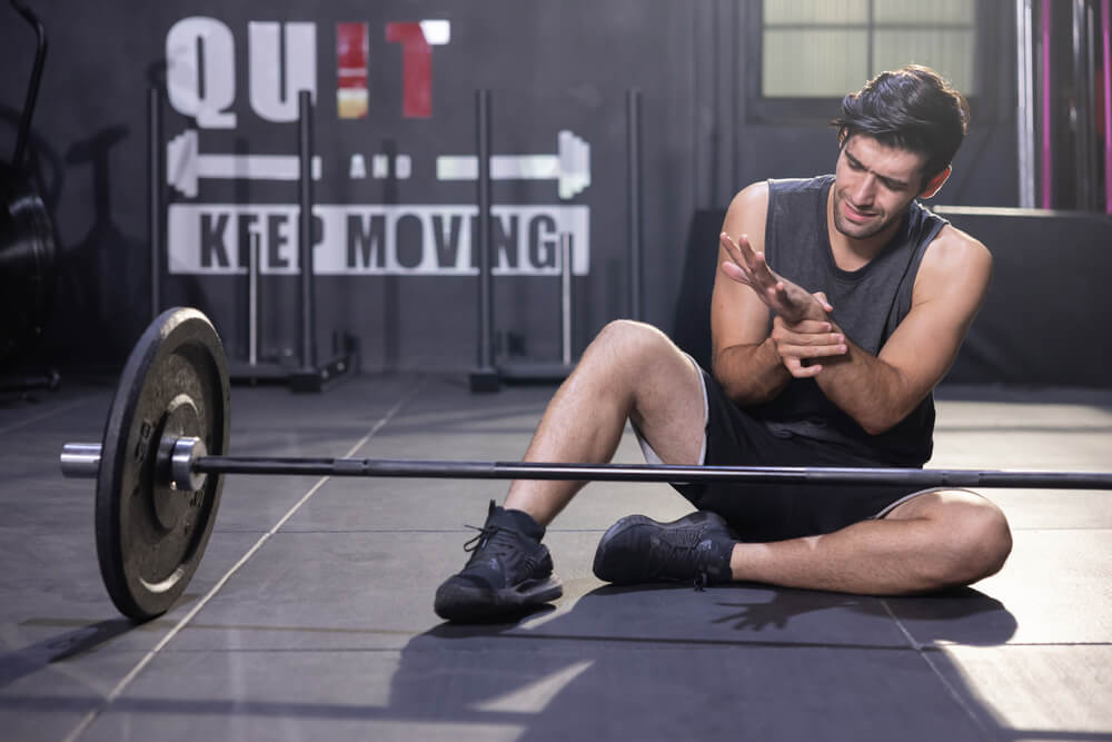 These 4 issues could be why your wrist hurts when benching shutterstock 1955353897 why does my wrist hurt when benching