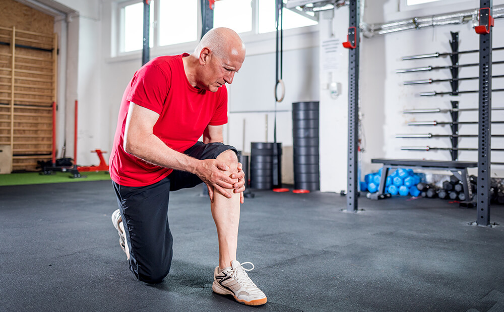 Lower leg pain after knee replacement? Here's why and how to manage it senior man at the gym suffering from pain in knee 2021 08 30 00 36 09 utc 1 lower leg pain after knee replacement? here's why and how to manage it knee pain