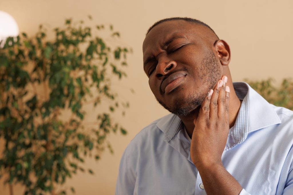 Why Does My Neck Hurt When I Take A Deep Breath? AdobeStock 1053795368 why does my neck hurt when i take a deep breath? neck pain