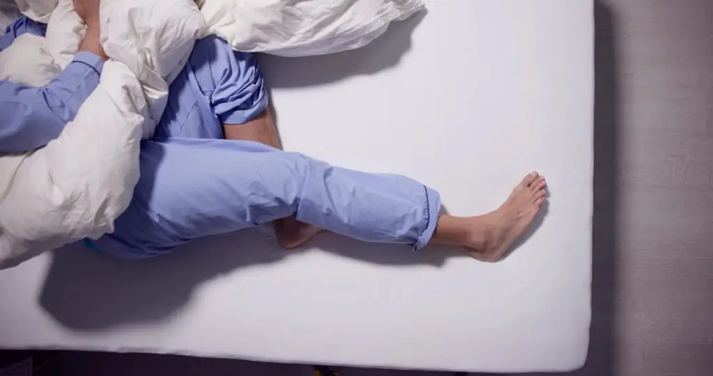 6 Reasons You Have Leg Pain When Lying Down AdobeStock 609398943 scaled 1 6 reasons you have leg pain when lying down leg pain